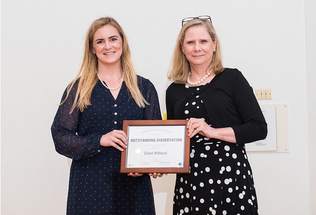 Claire Witherel receiving the Outstanding Dissertation Award 2019